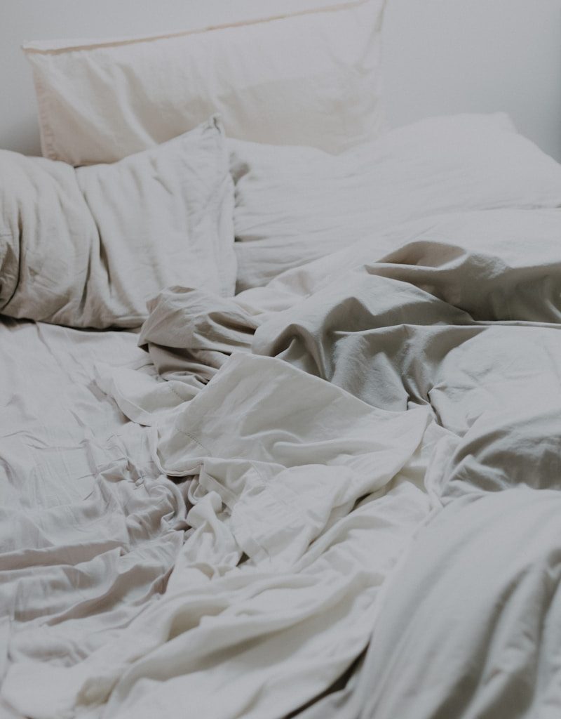 white pillows and bed comforter