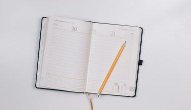 pencil on opened notebook
