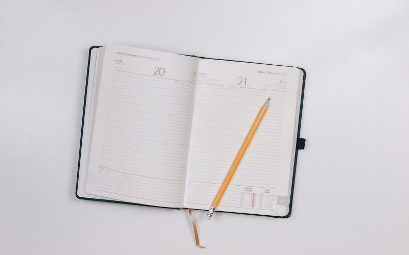pencil on opened notebook