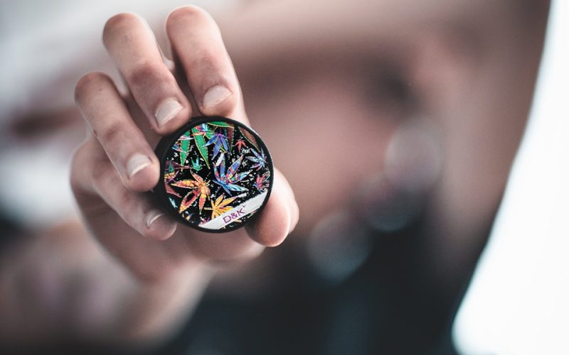 person holding round case