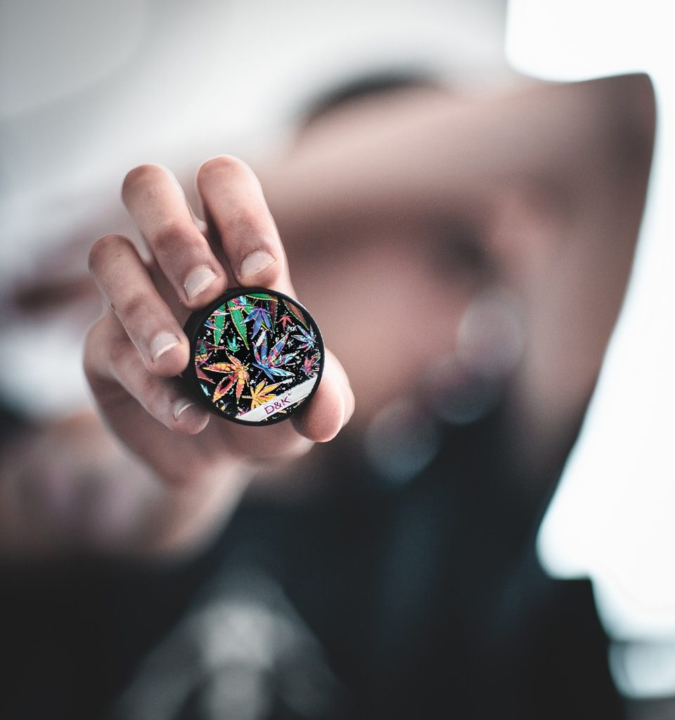 person holding round case