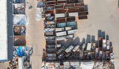 Drone shot of a recycling yard in Regensburg, Germany with containers and sorted materials.
