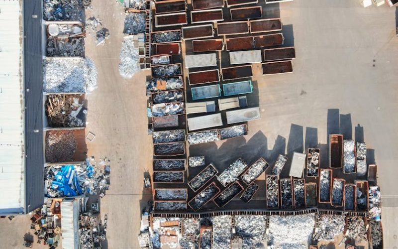 Drone shot of a recycling yard in Regensburg, Germany with containers and sorted materials.