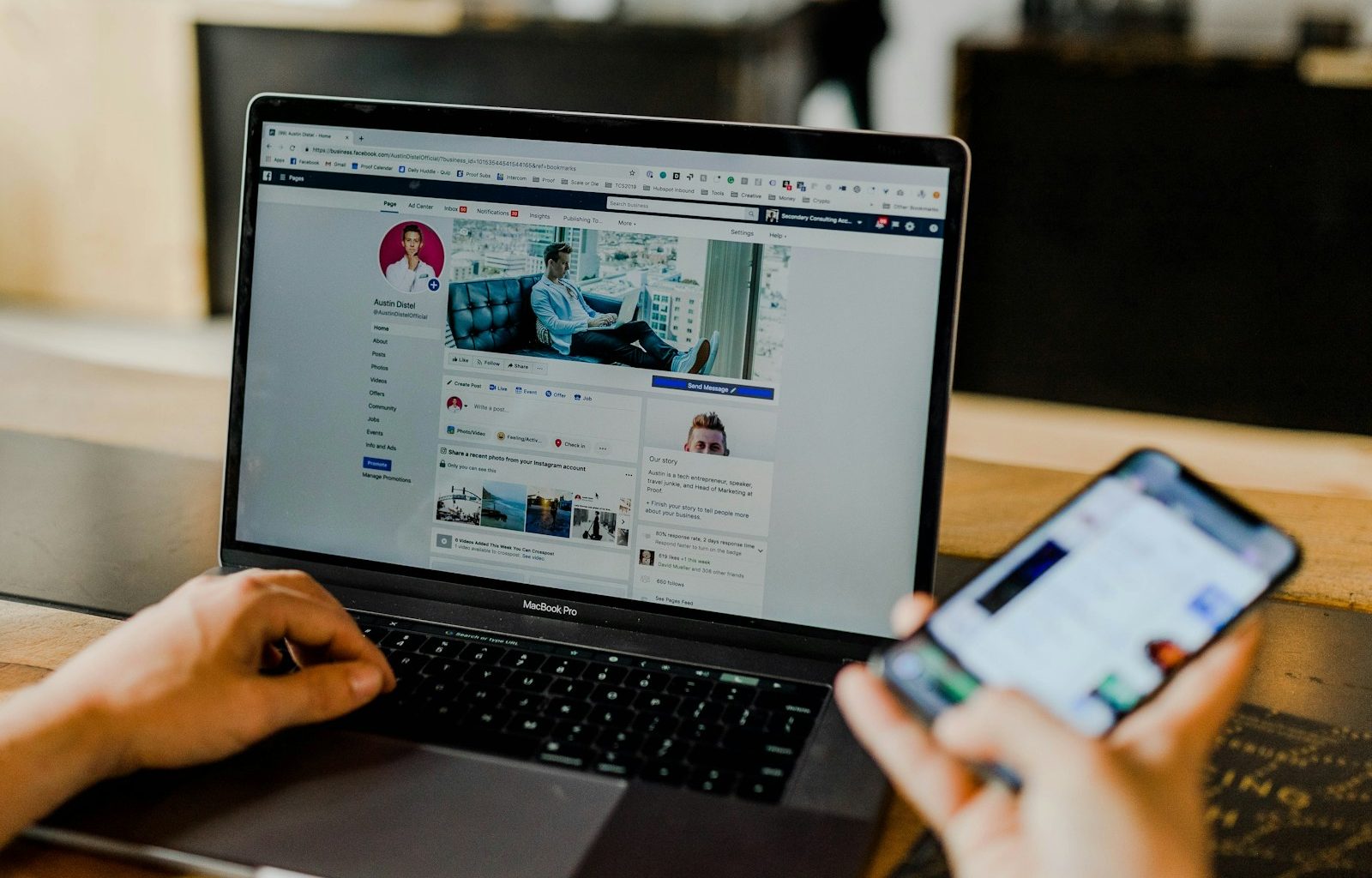 person using both laptop and smartphone