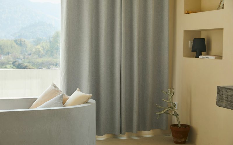 white throw pillow on white couch